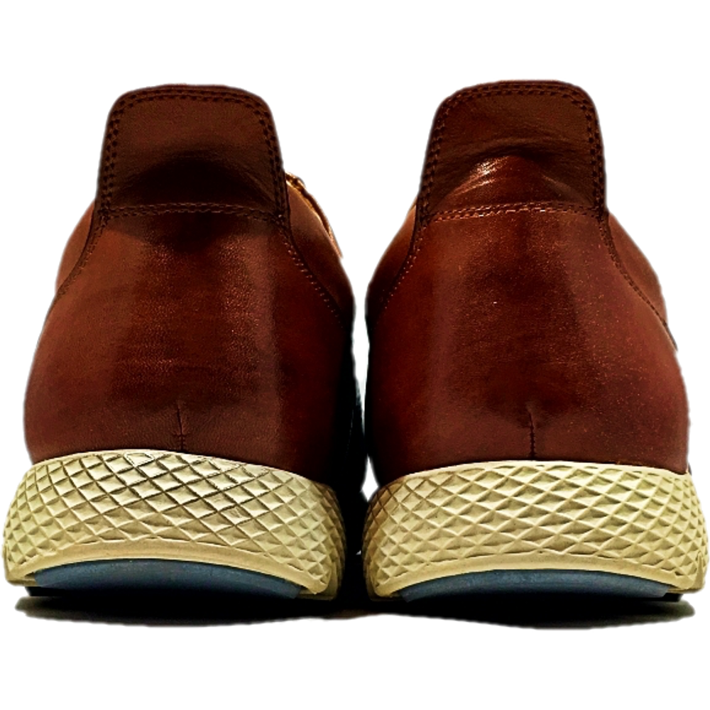 back of pair of leather shoes with  tan rubber sole